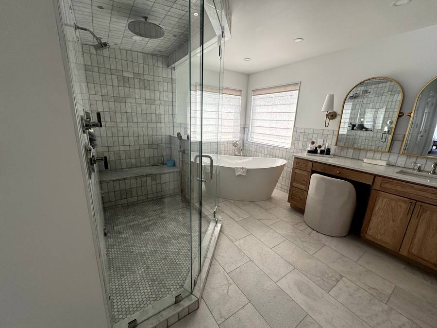 Primary bath — tiled shower and freestanding tub